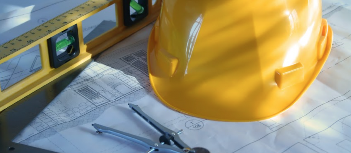 Hard hat, level and blueprints